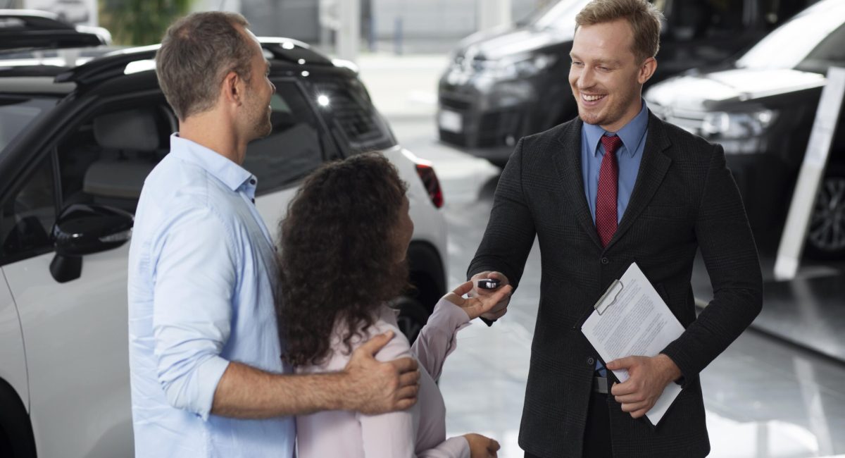 happy-couple-car-showroom